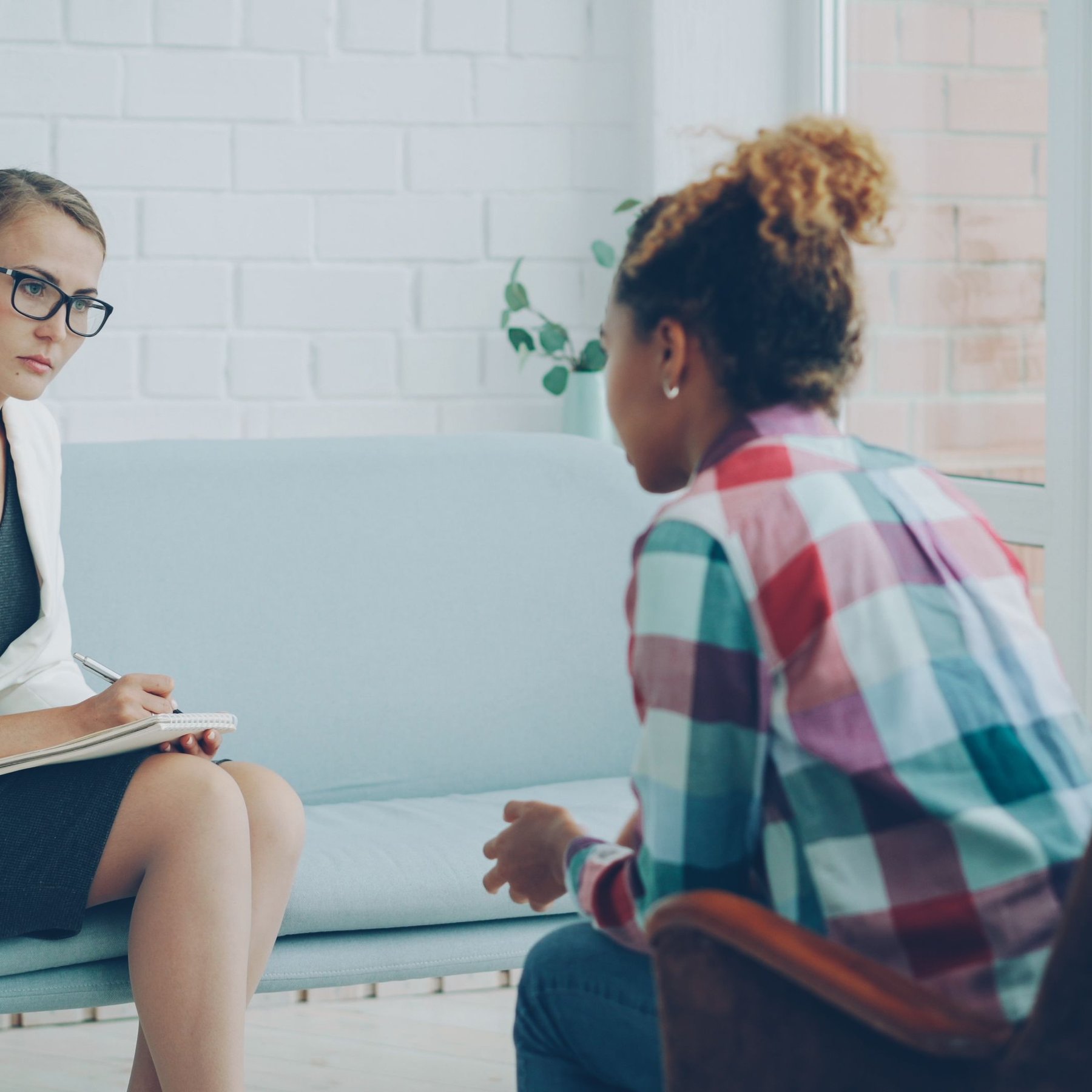 A professional counselling session between two women