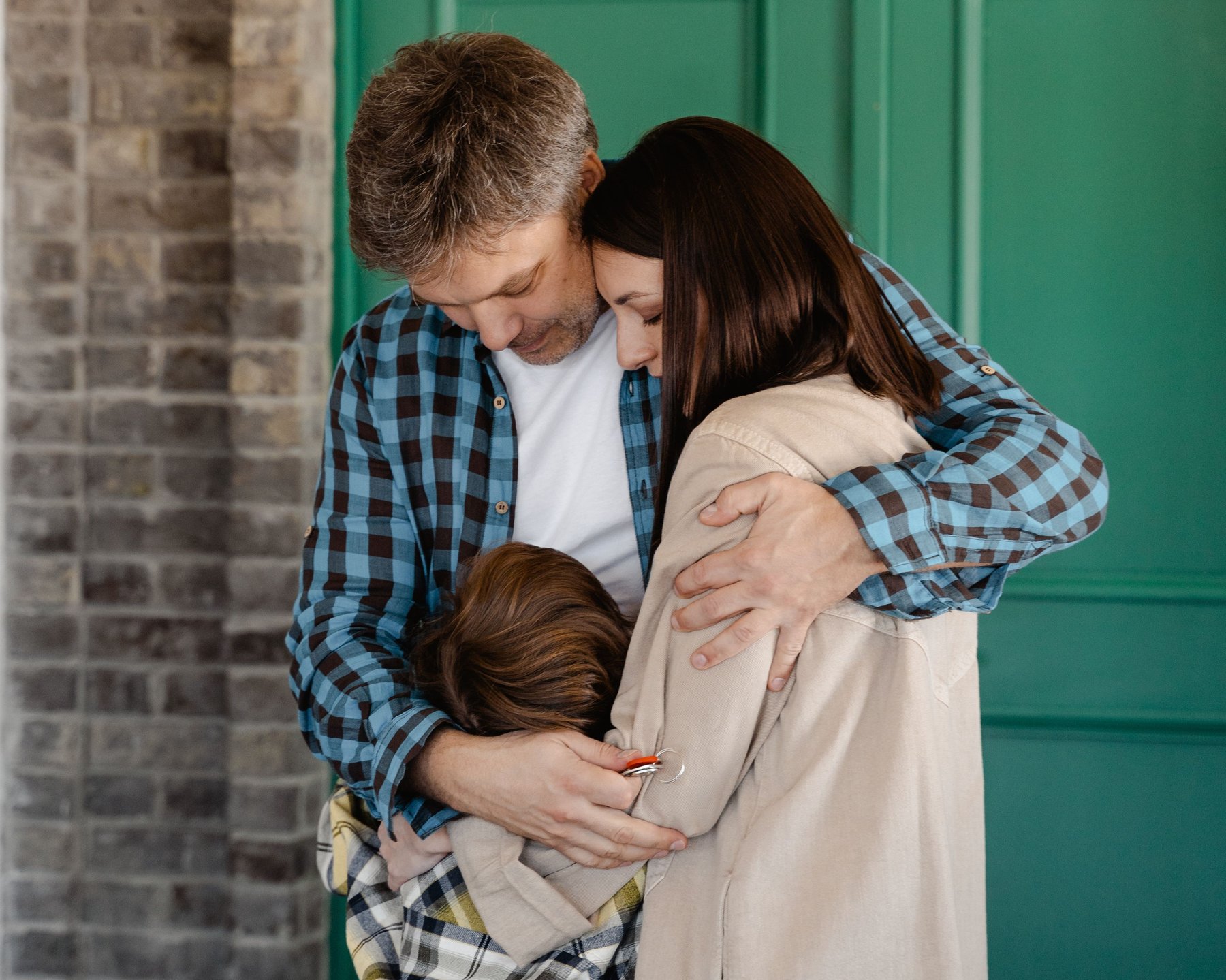 A family embracing together at home